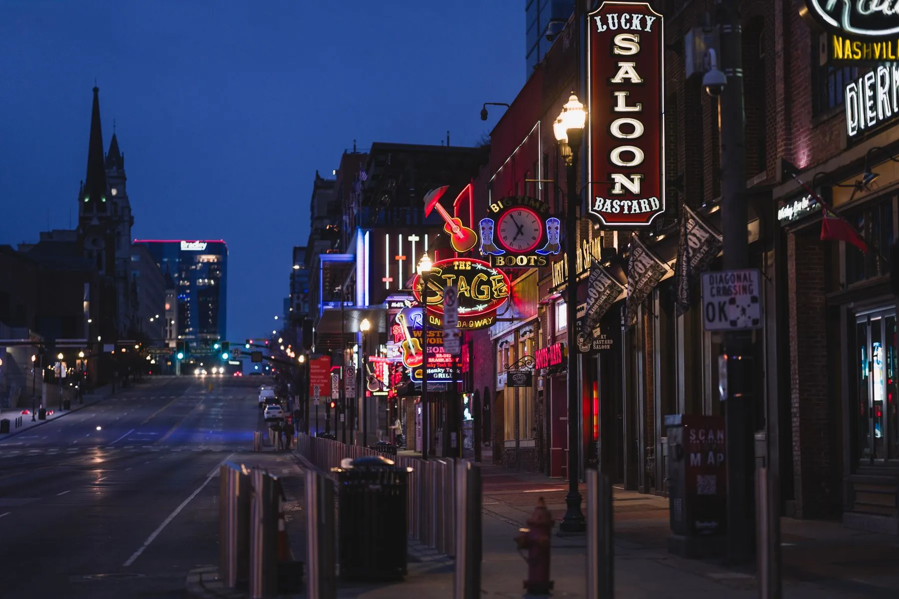 Neon signs lighting up Broadway in downtown Nashville